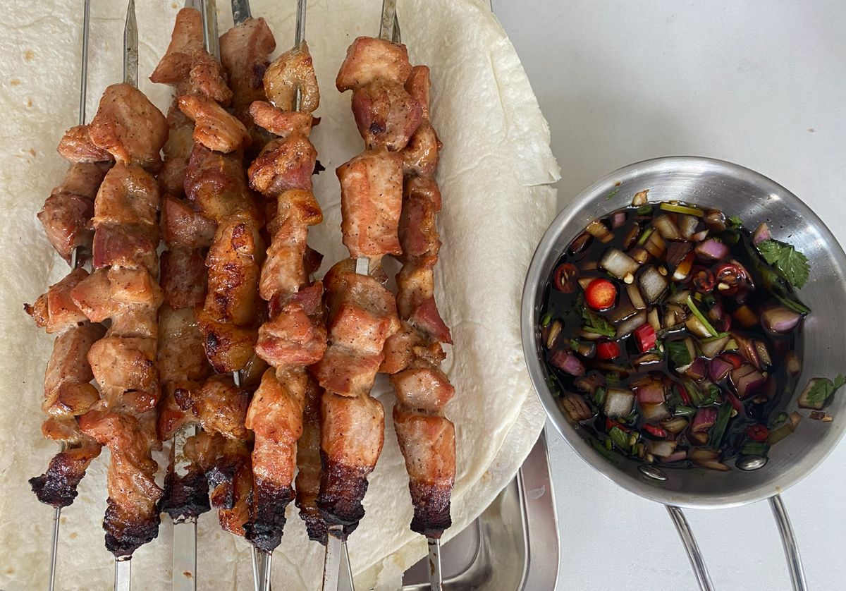 grilled meat skewers with dipping sauce