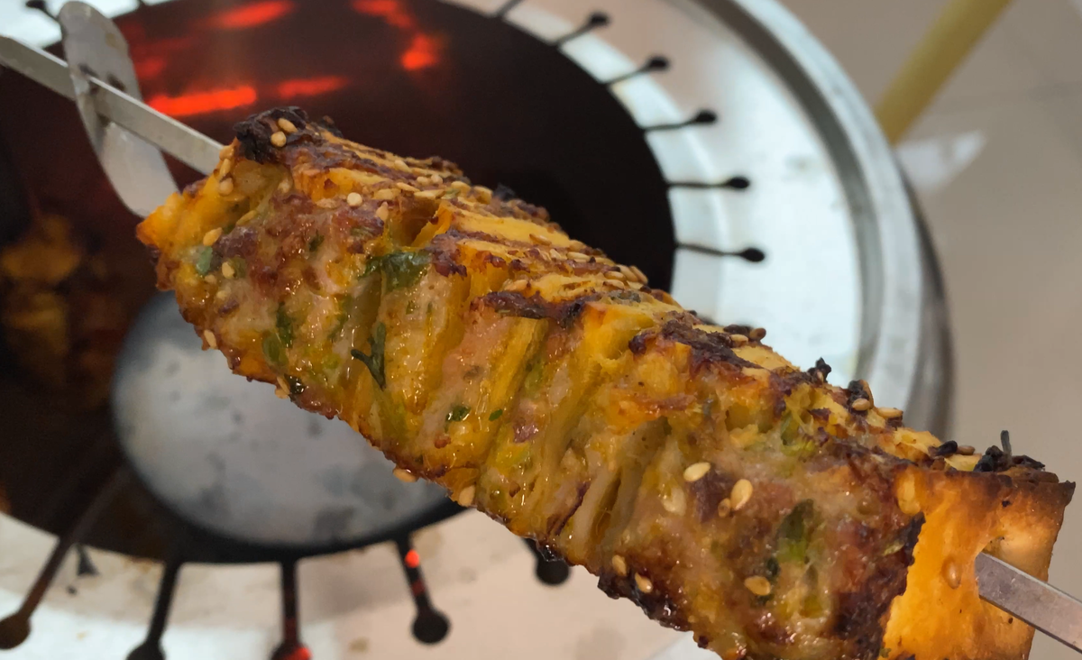 showcase of viral tortilla meat kabob on skewer