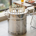 22 skewers double-layer nested bucket smokeless charcoal barrel hanging grill on a wooden table outdoors